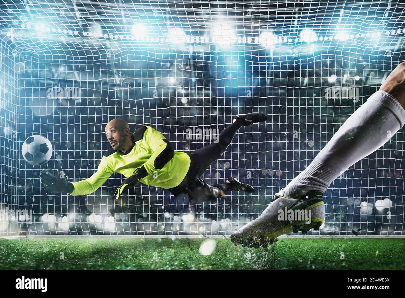 Gardien attrape la balle dans le stade au cours d'un match de football. Banque D'Images