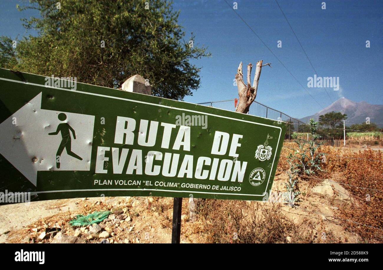 A Beat Up Sign Announces The Evacuation Route Away From The Nearby 14 200 Foot Volcano Of Fire R Spewing Smoke In Tonila February 19 The Volcano Of Fire Located On The Border Between