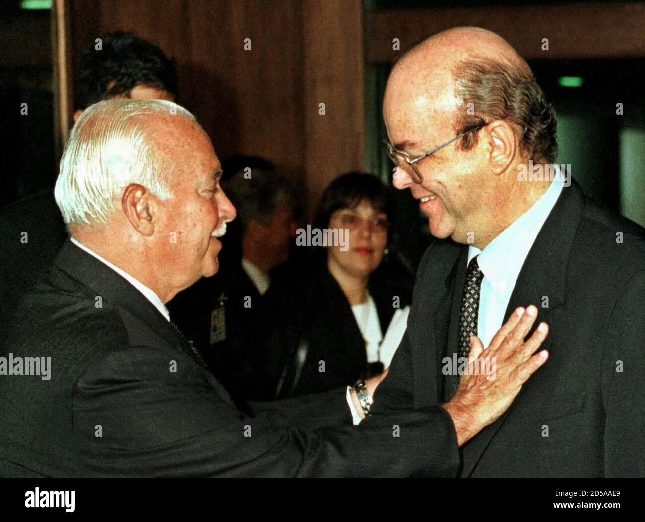 Central Bank President Francisco Lopes (R) gets a pat on the jacket from  Senate President Antonio Carlos Magalhaes after a brief meeting in Brasilia  January 19. The Central Bank moved to bolster