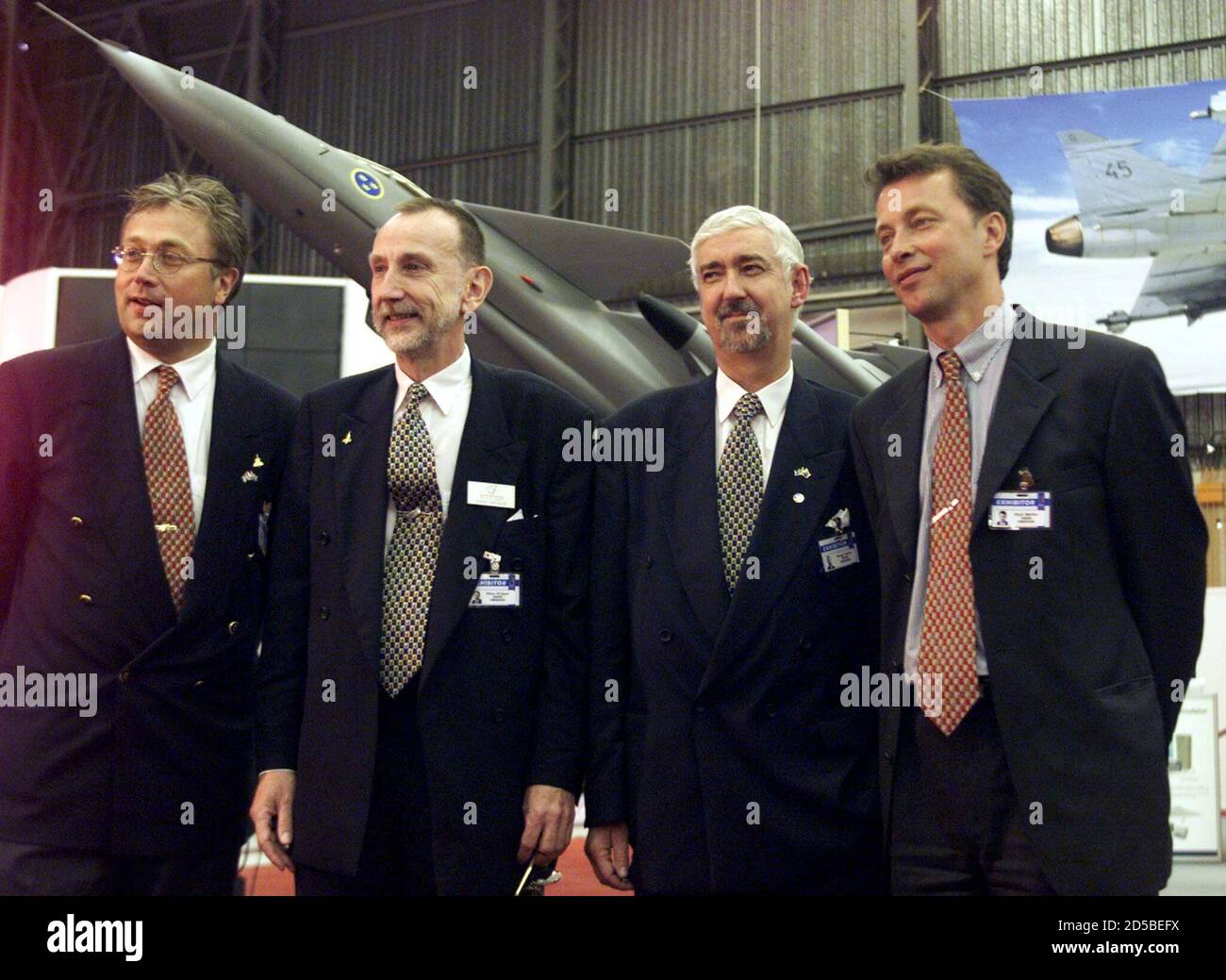 Members of the SAAB Gripen, Magnus Kalrberg (L) managing director of SAAB  Gripen in South Africa, Hans Kruger, Bengt Halse Saab Chief Executive (C)  and Kuell Moler (R) pose for photographs before