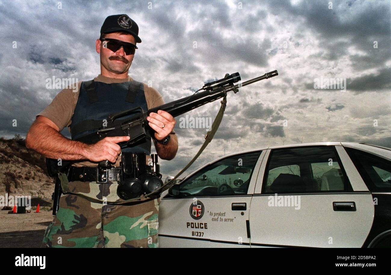 Los Angeles Police department SWAT team member Rick Neil displays a M16 assault weapon