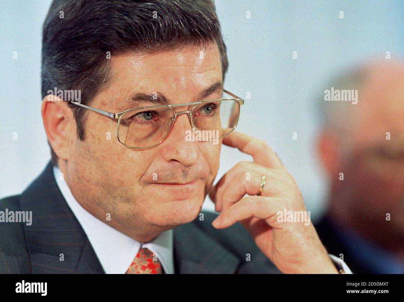 HypoVereinsbank chief executive Albrecht Schmidt looks on during his speech  at a news conference in Munich, February 23. Schmidt said on Tuesday his  bank had definitively put behind it costs related to