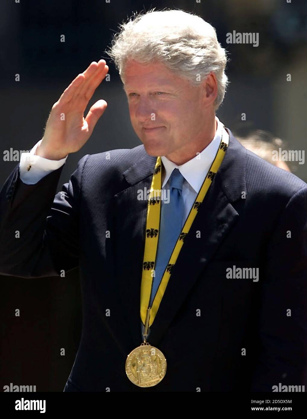 U.S. President Bill Clinton salutes after he was decorated with the  prestigous Charlemagne prize by Aachen´s major Juergen Linden during a  ceremony in Aachen, June 2. [German Chancellor Gerhard Schroeder, honouring  Clinton's