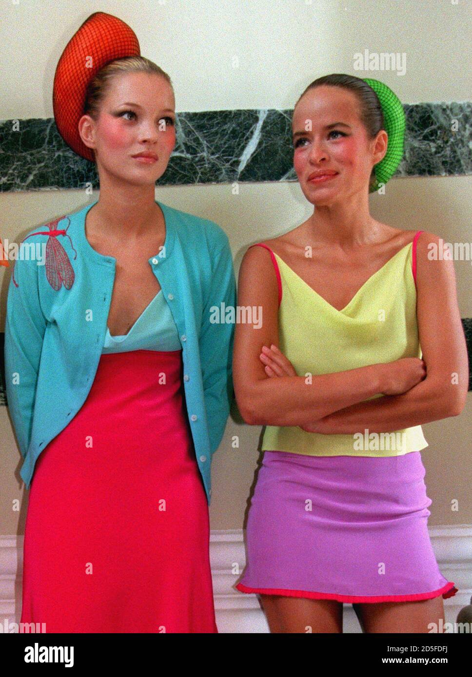 British models Kate Moss (L) and Jade Jagger wait to walk down the catwalk  wearing clothes by designer Matthew Williamson, September 26. The show was  the first by Williamson at London Fashion