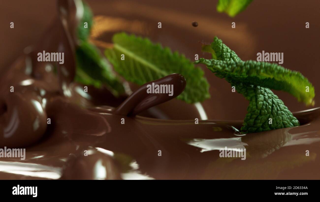 Détail du versement du chocolate chaud avec des feuilles de menthe. Prise de vue macro studio. Banque D'Images