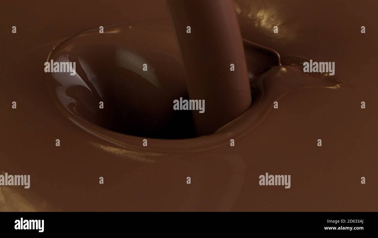 Détail du versement du chcocolate chaud avec éclaboussures. Prise de vue macro studio. Banque D'Images