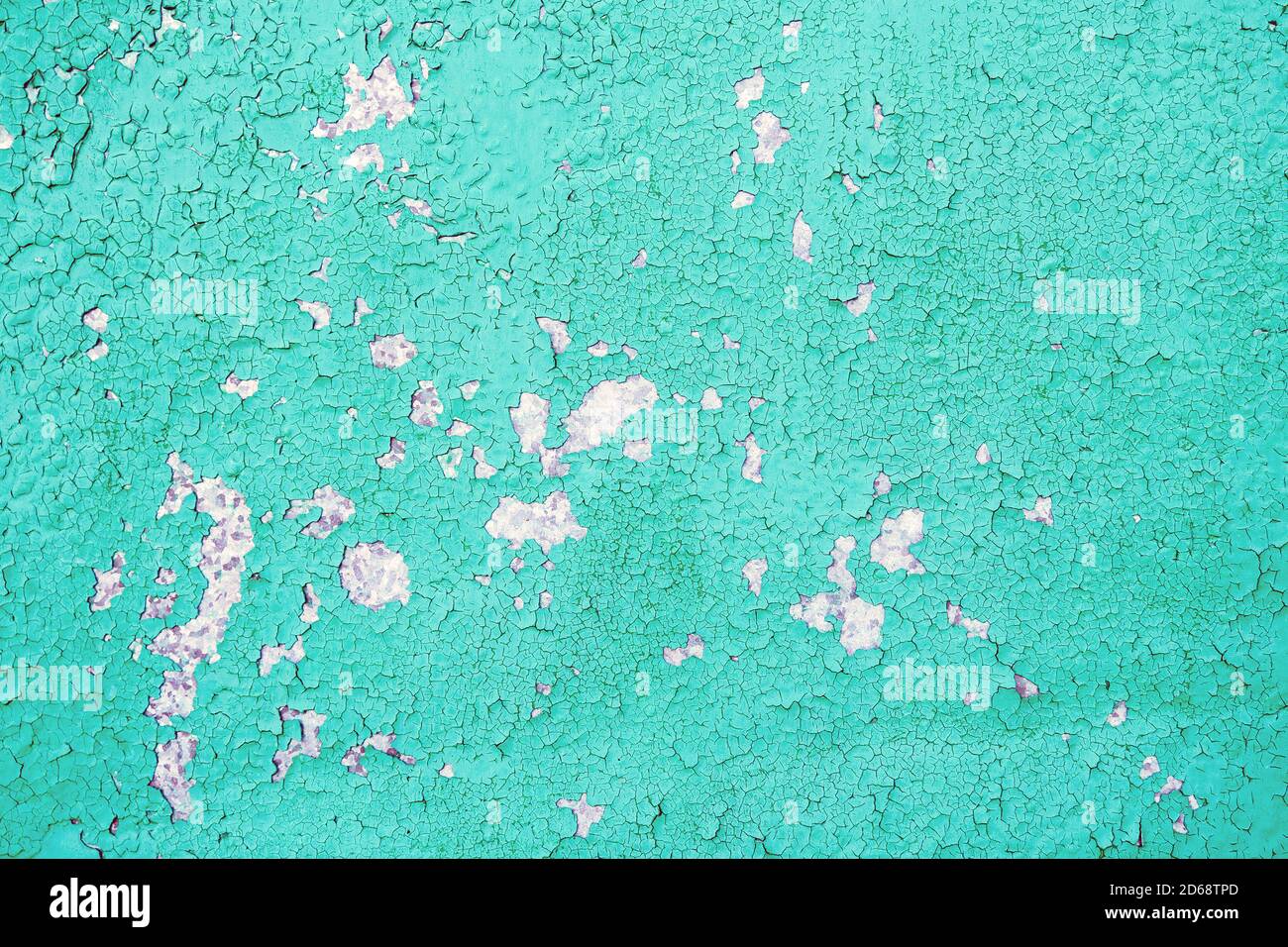 ancienne peinture bleue fissurée sur le mur de ciment Banque D'Images