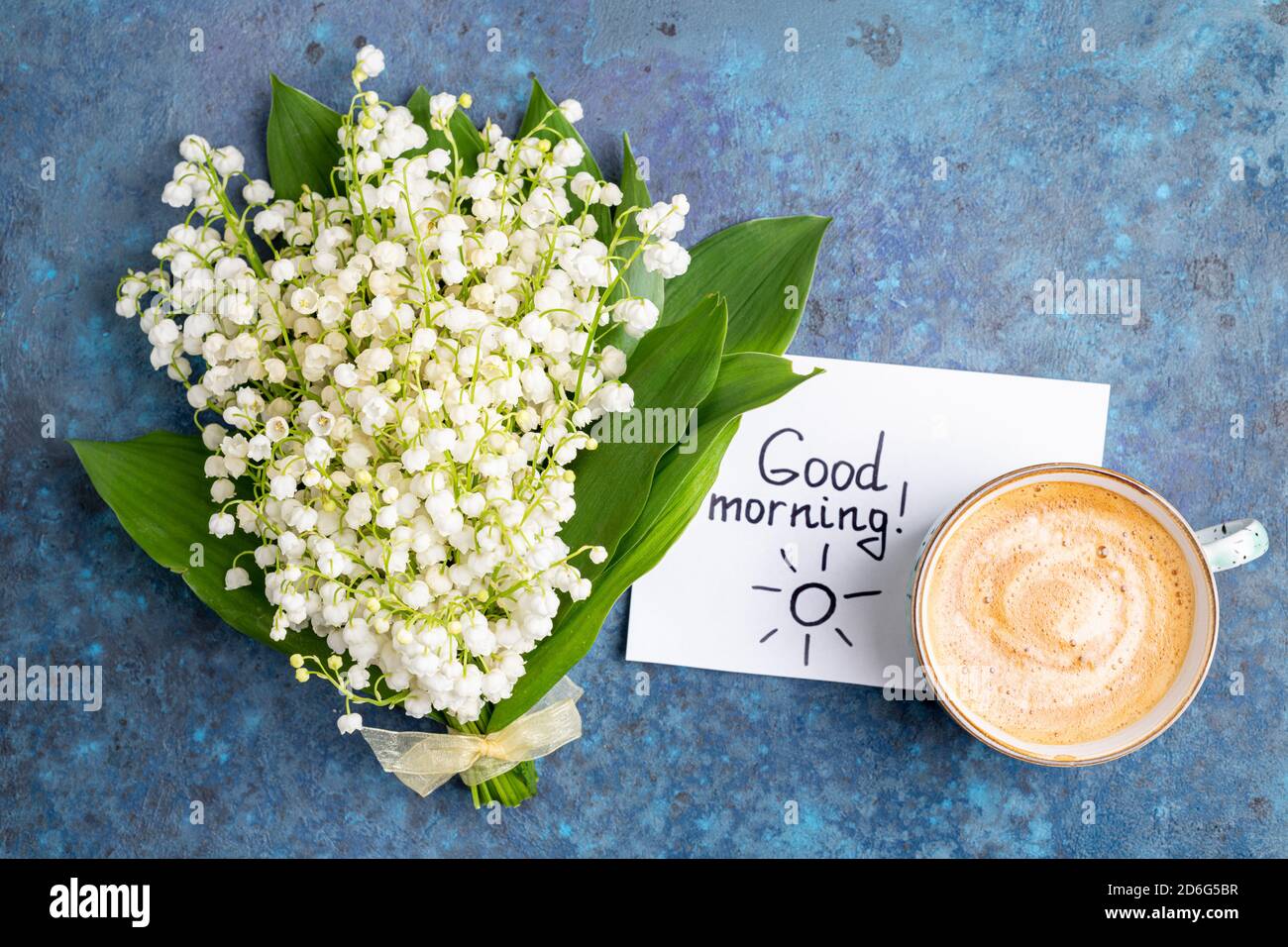 Notes Bonjour Et Tasse De Cafe Avec Bouquet De Fleurs Lys De La Vallee Sur Fond Bleu Petit Dejeuner Cafe Du Matin Concept De Carte Vue Du Dessus Photo Stock Alamy