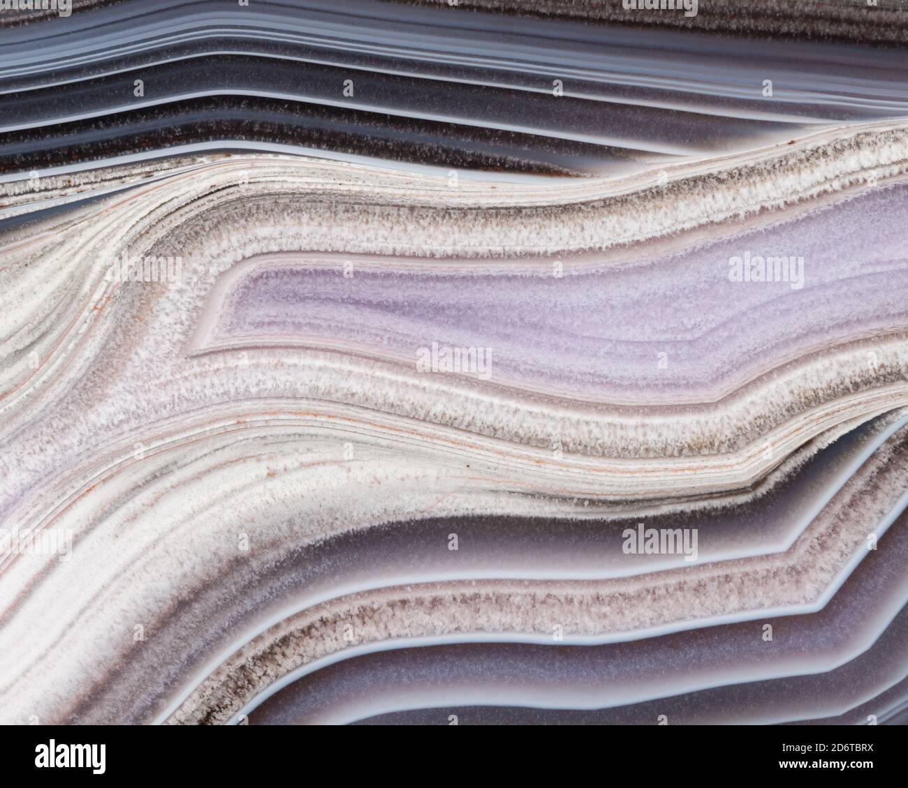 Photographie macro des motifs de bandes dans un agate Banque D'Images