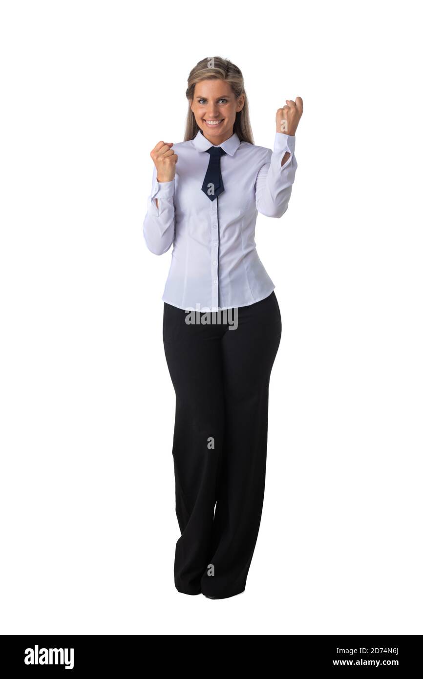 Jeune femme d'affaires gagnante tenant des poings isolés sur fond blanc portrait de studio pleine longueur Banque D'Images