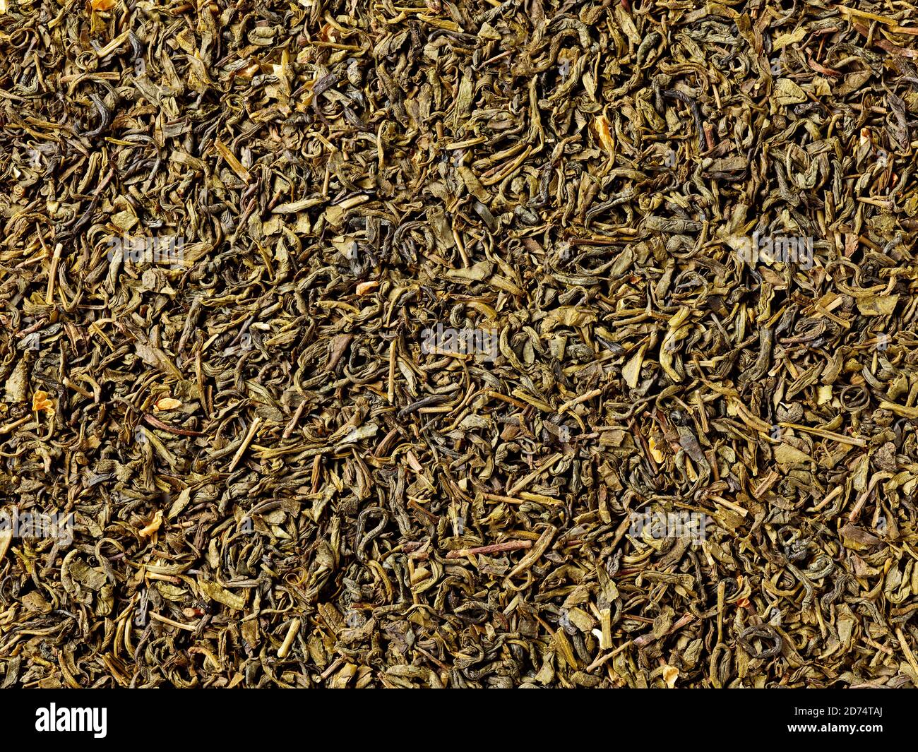 Fond de feuilles de thé vert jasmin séché, vue plate Banque D'Images