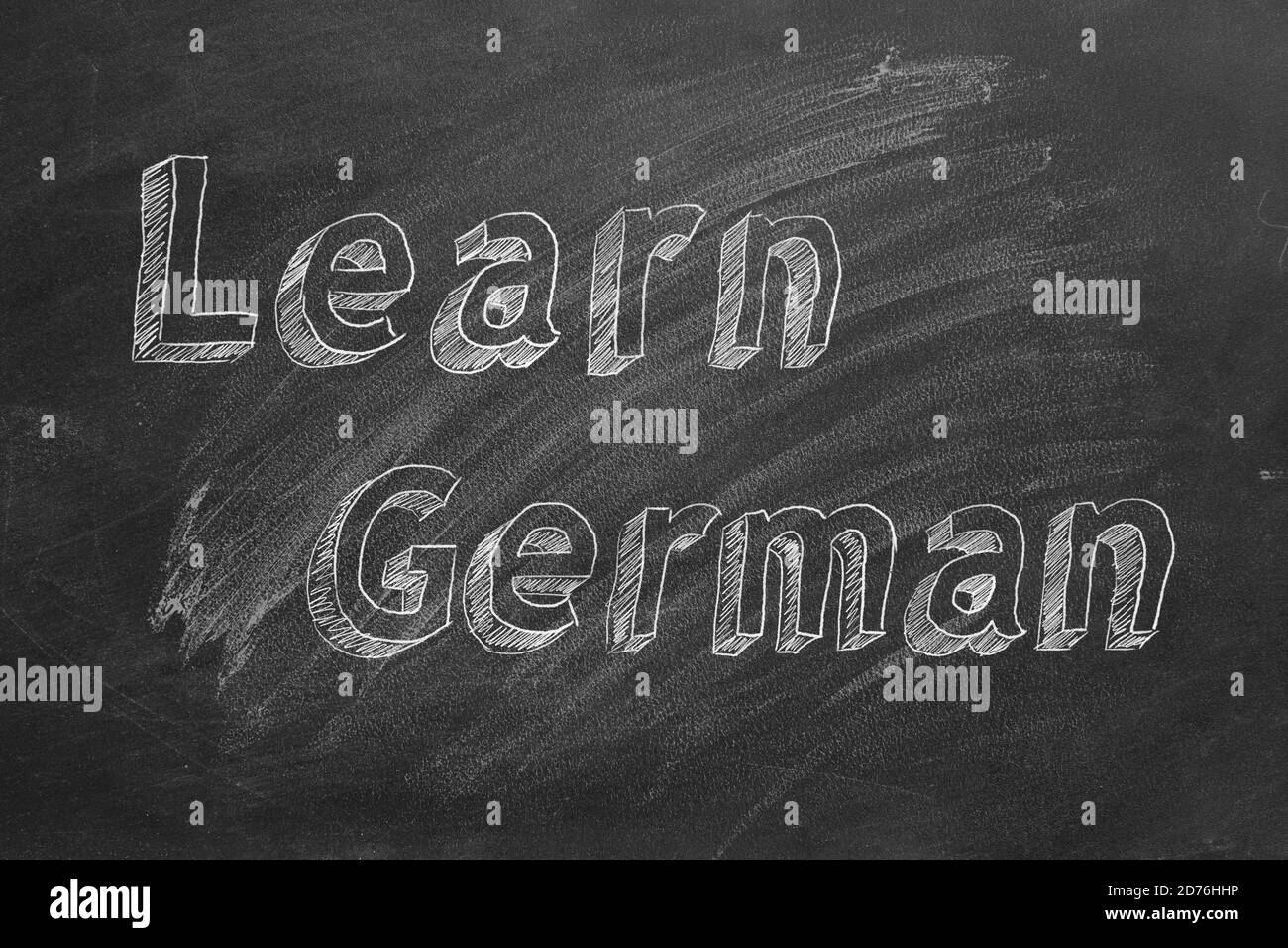 Dessin à la main « apprendre l'allemand » sur tableau noir Banque D'Images