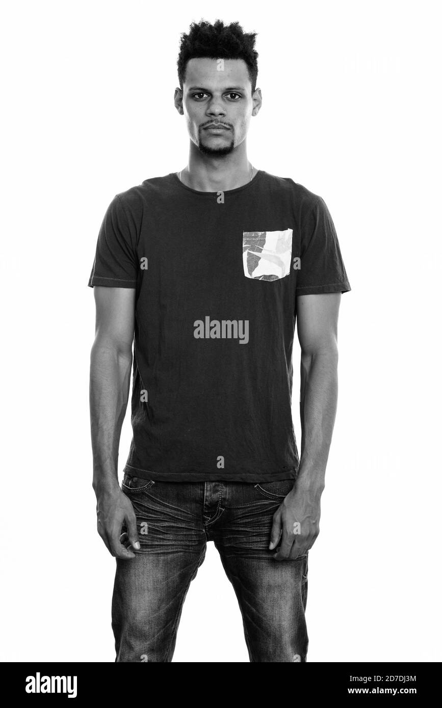 Studio shot of young African man standing Banque D'Images Studio shot of young African man standing Banque D'Images