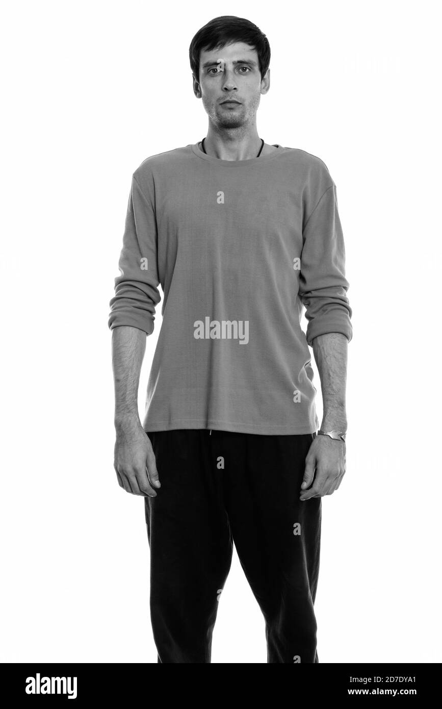 Studio shot of young handsome man standing Banque D'Images Studio shot of young handsome man standing Banque D'Images
