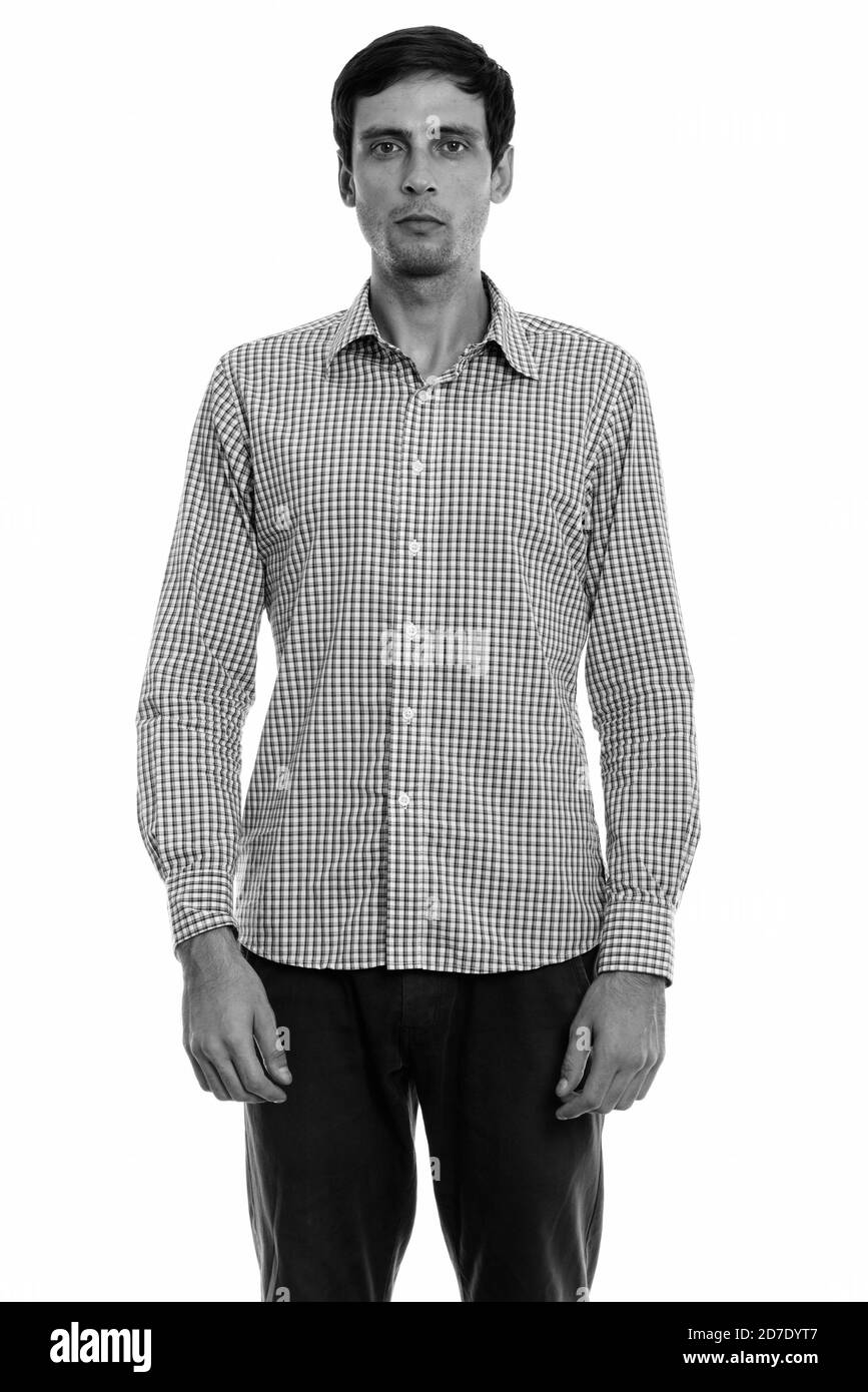 Studio shot of young handsome businessman standing Banque D'Images Studio shot of young handsome businessman standing Banque D'Images
