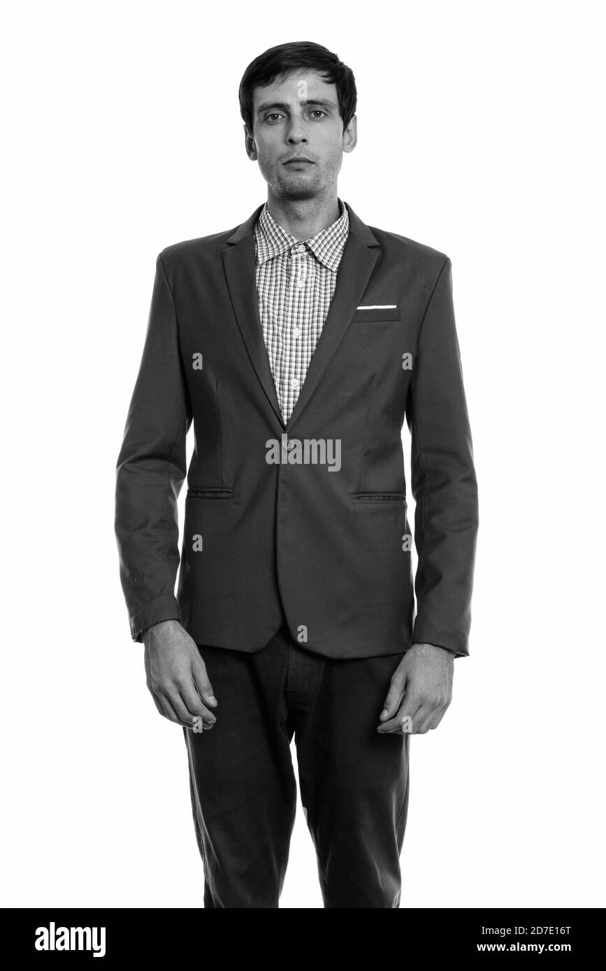 Studio shot of young handsome businessman standing Banque D'Images Studio shot of young handsome businessman standing Banque D'Images