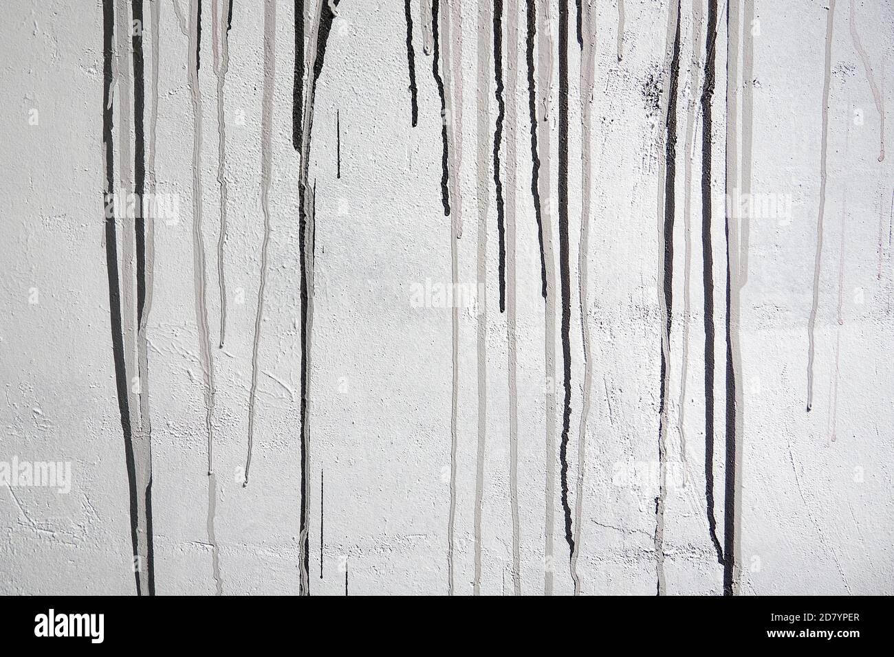 mur en béton avec des taches grises et noires sur le mur Banque D'Images