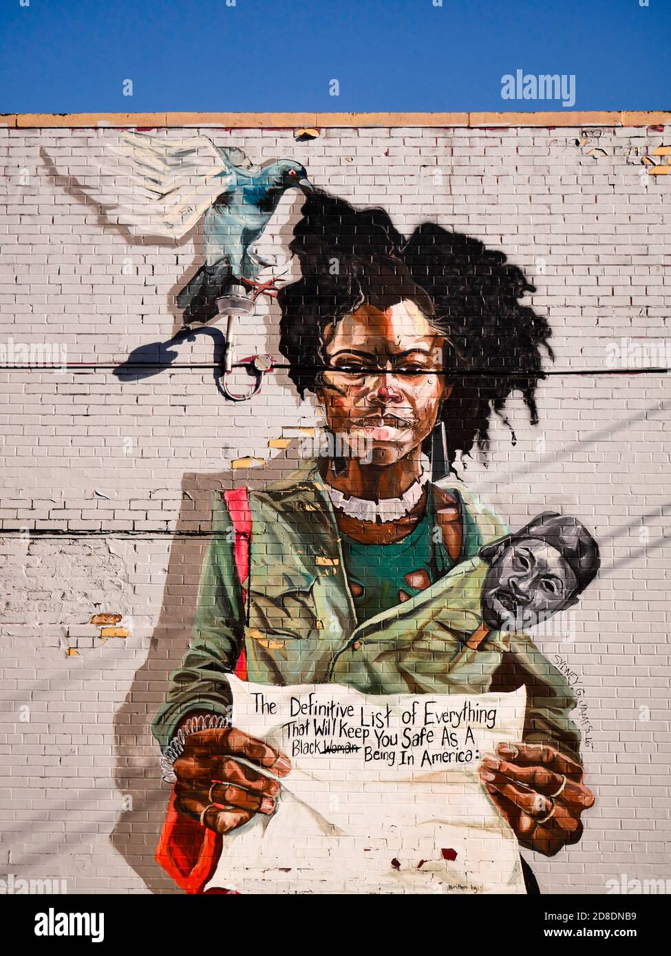 Peinture murale près du marché de l'est de Detroit avec femme afro-américaine, art réalisé par Sydney James Banque D'Images