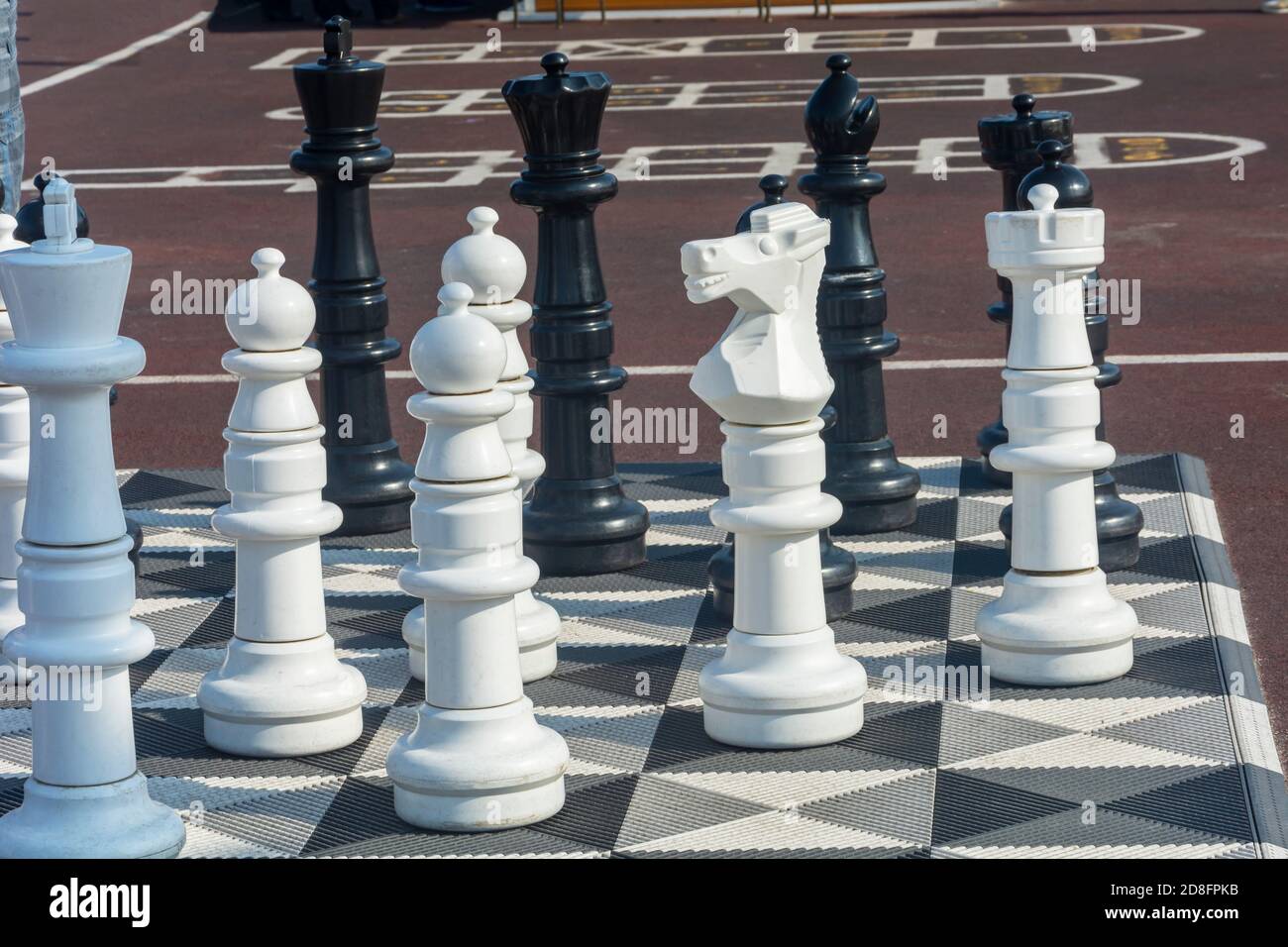 Children playing chess game on street with large size chess pieces and chess  board on street of Mile End in Le Plateau Mont Royal.Montreal.Quebec.Canada  Stock Photo - Alamy