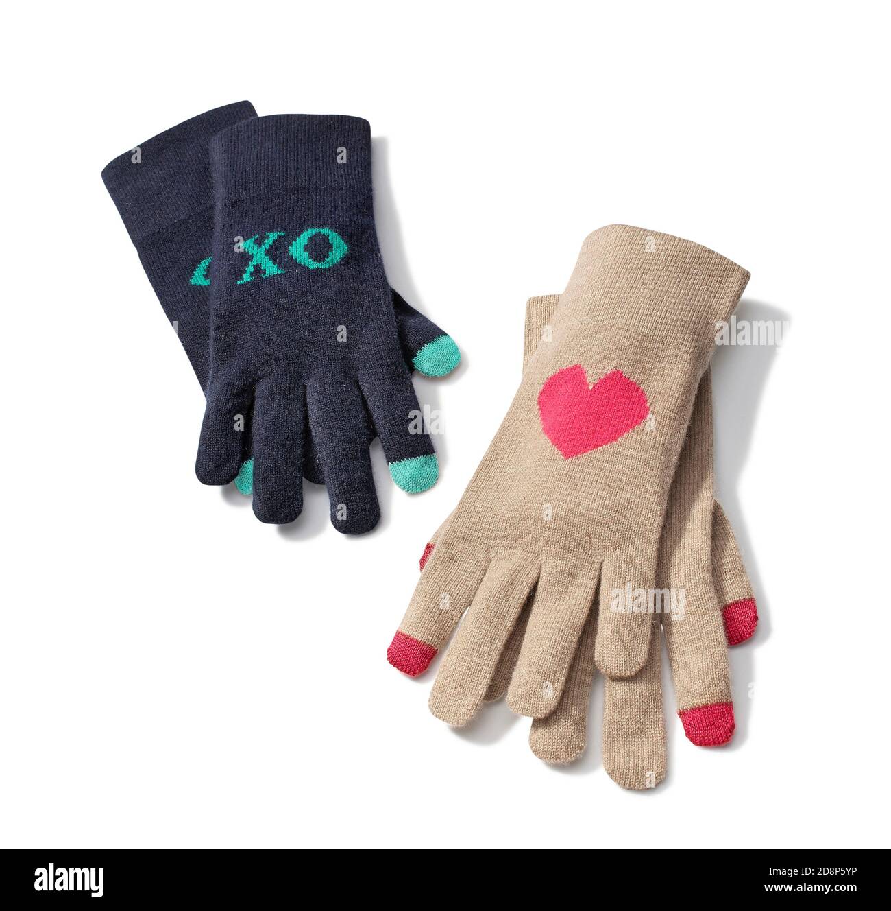 Deux paires de gants sur le thème de l'amour avec cœur et « XO » de Le livre de présentation de C.Wonder's Holiday 2013 est photographié sur fond blanc Banque D'Images