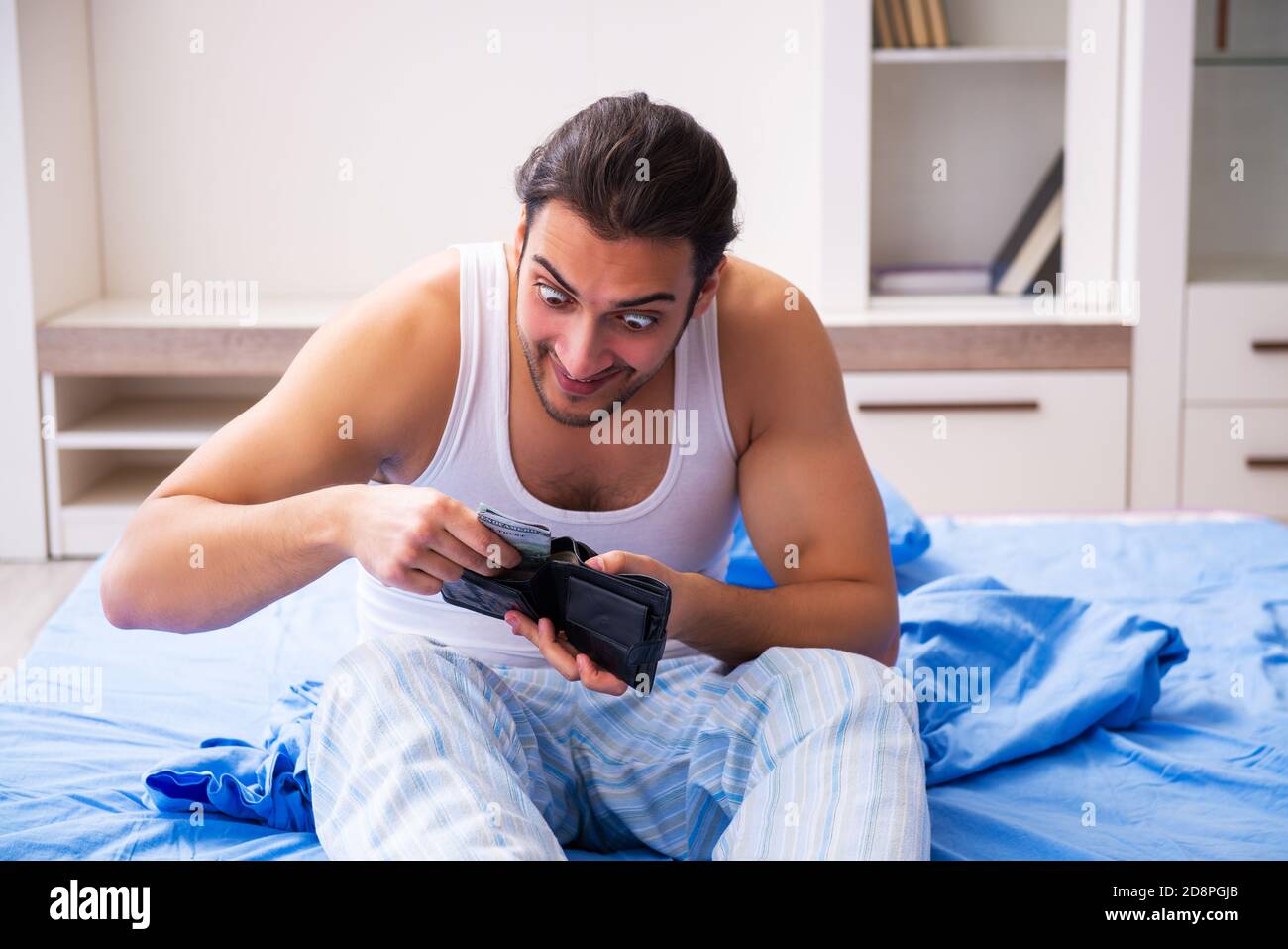 Jeune homme dans le concept d'insolvabilité Banque D'Images