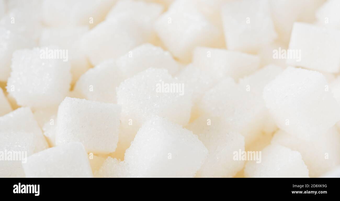 Texture du cube de sucre fond ingrédient alimentaire sucré, grenaille en studio santé risque élevé de diabète, et la prise de calorie concept Banque D'Images