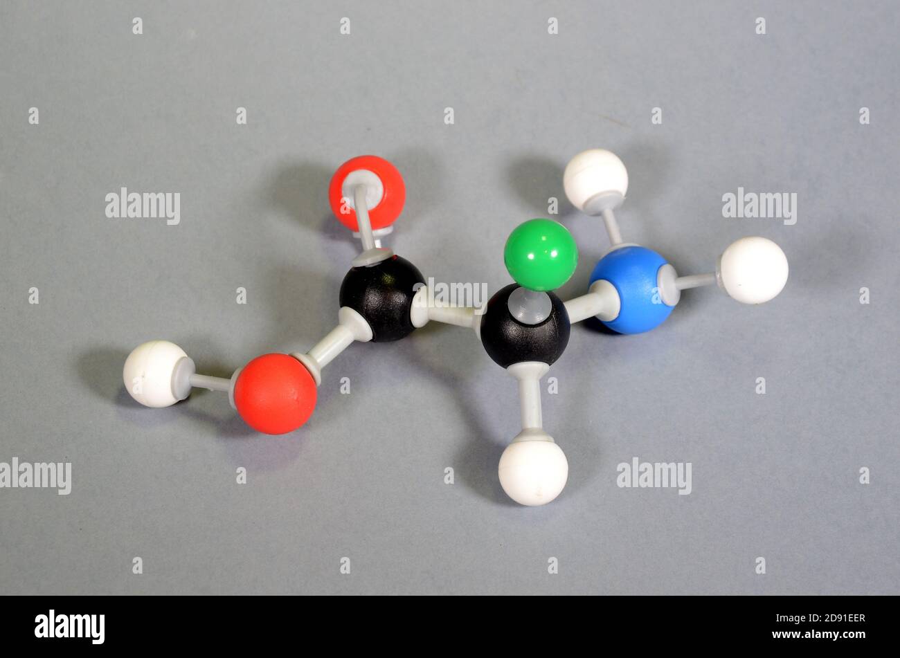 Modèle moléculaire d'acide aminé. Le noir est le carbone, le rouge est l'oxygène, le blanc est l'hydrogène, le bleu est l'azote, et le vert représente une goupe de repos qui peut avoir un chiffre Banque D'Images