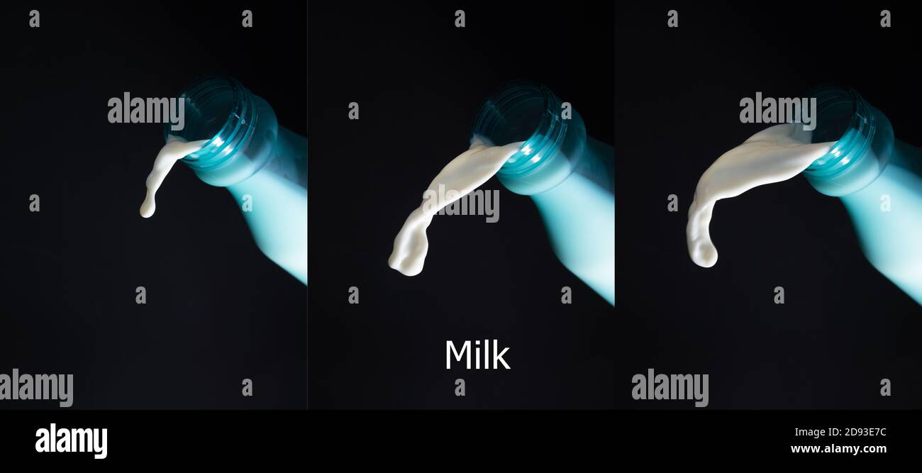 jeu de lait versé à partir d'un biberon ou d'une éclaboussure de liquide blanc isolé sur fond noir Banque D'Images