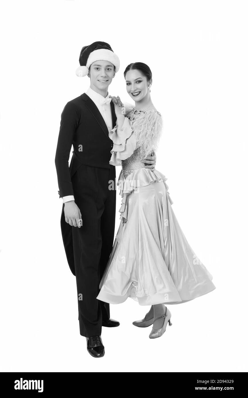 Valse d'hiver. heureux couple de danseurs célébrer Noël. smoking man in santa hat hug sa fille partenaire. La danse de salle de bal couple isolé sur blanc. meilleur show pour la partie. événement formel sur Noël. Banque D'Images