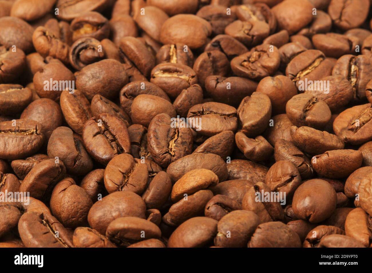 Tas de grains de café en vrac comme arrière-plan Banque D'Images