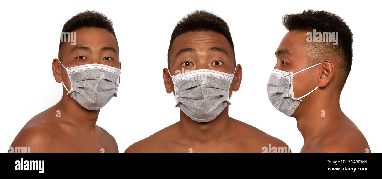 Le jeune asiatique porte un masque médical. Isolé sur fond blanc. Concept des épidémies de pneumonie, des épidémies de coronavirus et du danger de b Banque D'Images