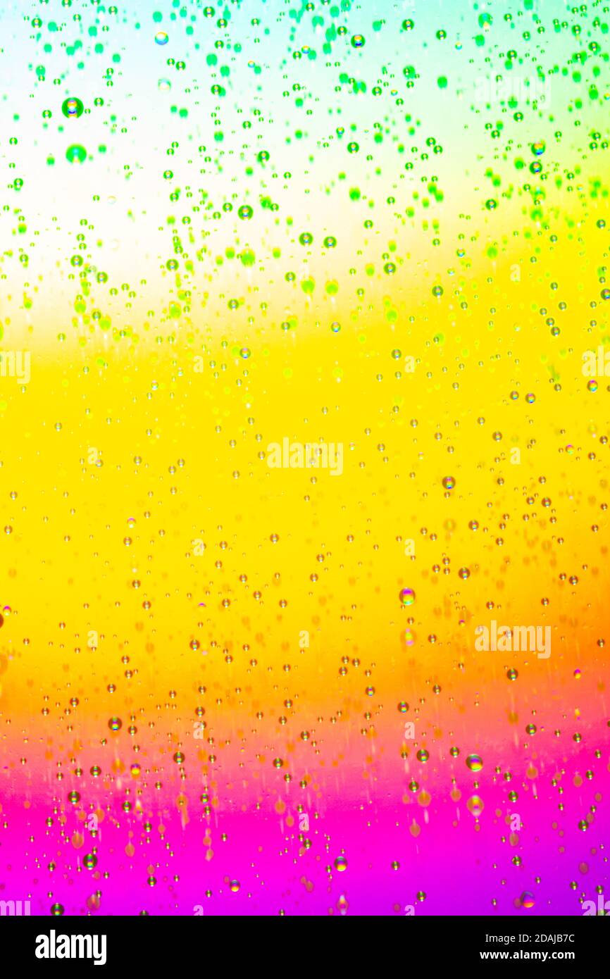 Fond abstrait dégradé coloré avec gouttelettes d'eau. Photographie macro Banque D'Images