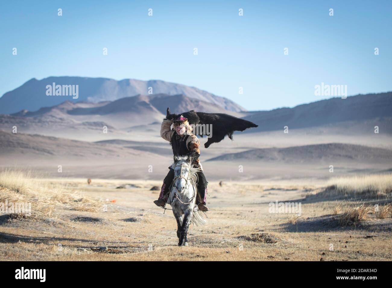 Le fils de SPAI Bashakhan pendant l'entraînement au jeu équestre mongol Buzkaschi, province d'Olgii, Mongolie Banque D'Images