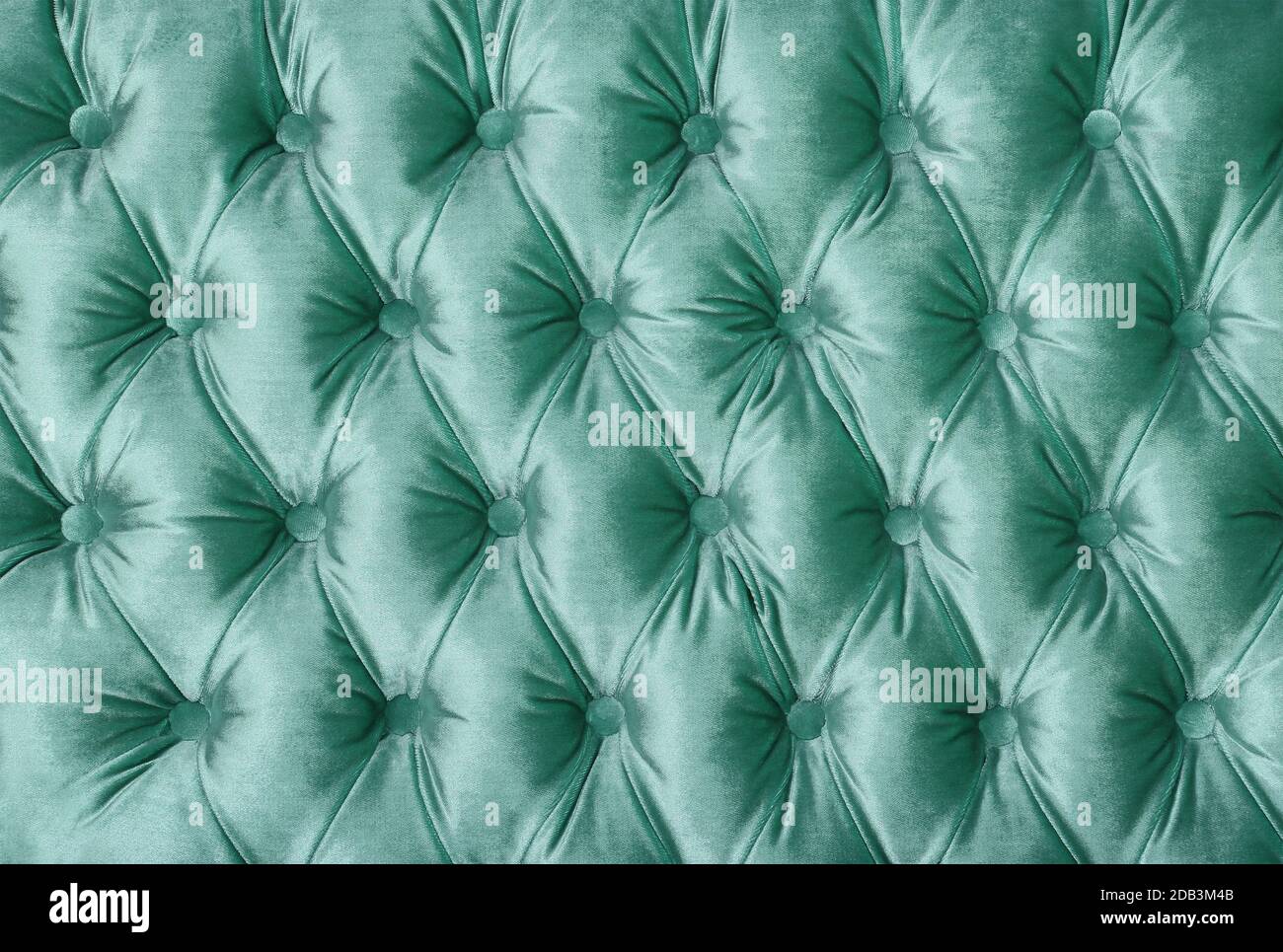 Velours vert pastel fond textile capitone, style Chesterfield rétro à carreaux doux meubles en tissu tufté à motif losanges décoration avec Banque D'Images