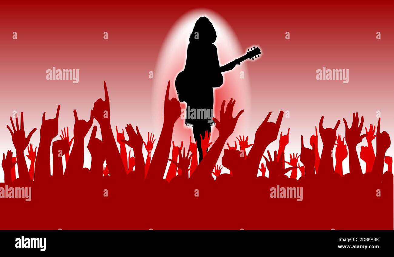 Les mains levées dans l'air à un concert d'une interprète féminine Banque D'Images