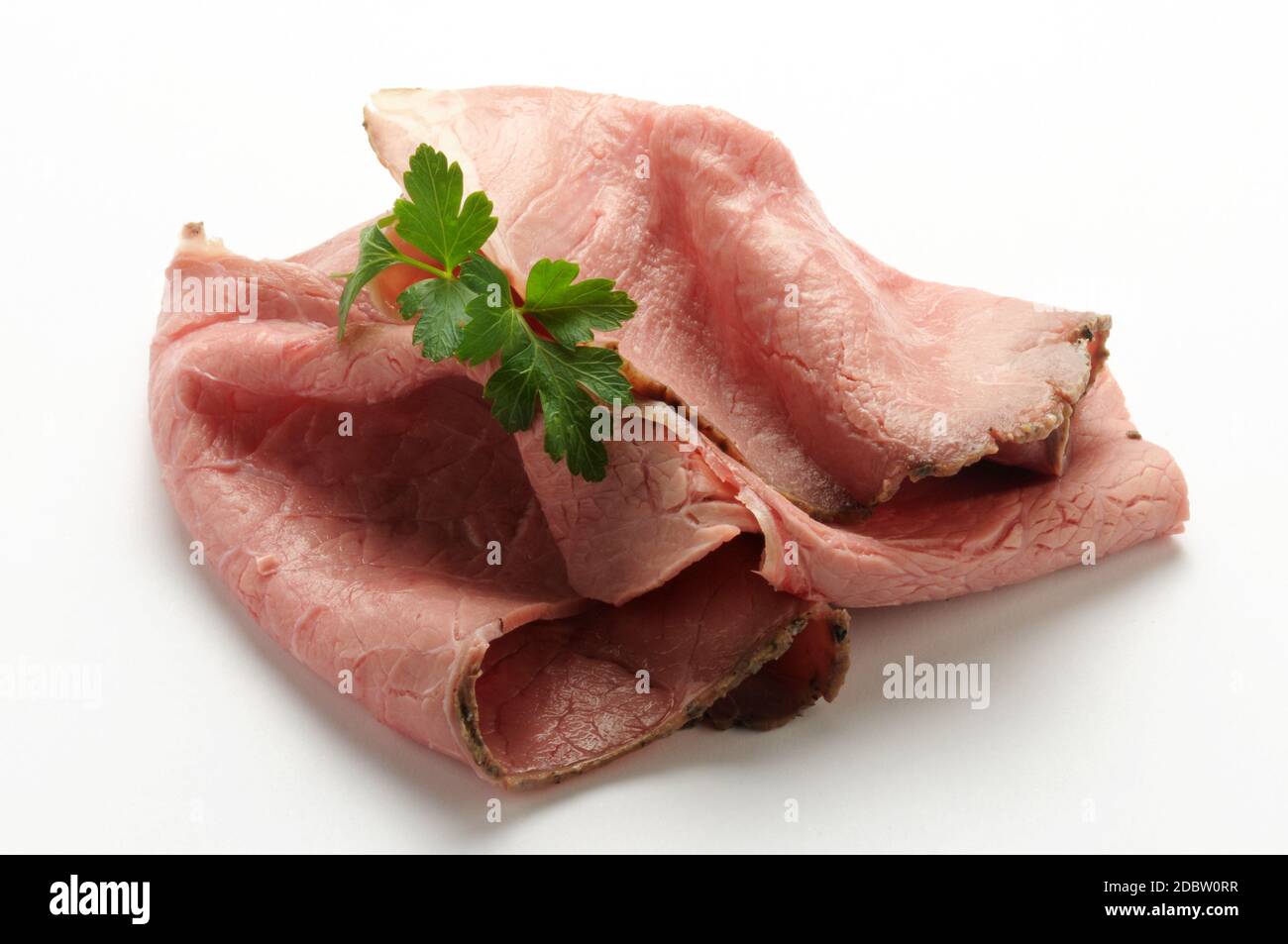 Rôti de bœuf isolé avec persil Banque D'Images