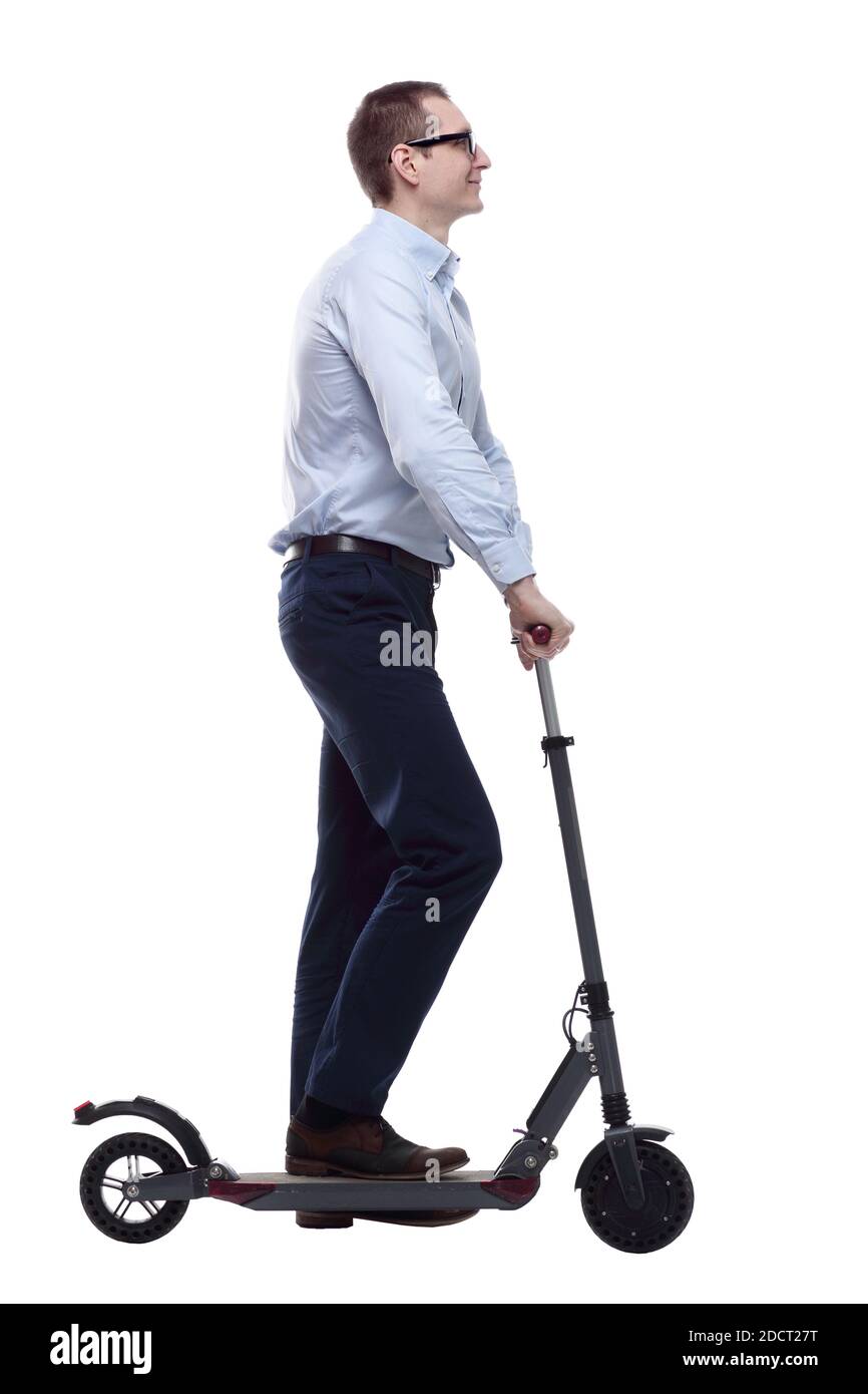 vue latérale. homme décontracté avec scooter électrique qui vous regarde Banque D'Images