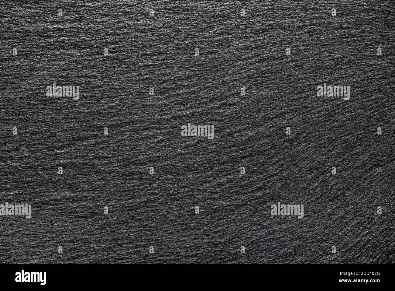 Arrière-plan en ardoise noire. Texture d'un tableau noir en pierre. Banque D'Images