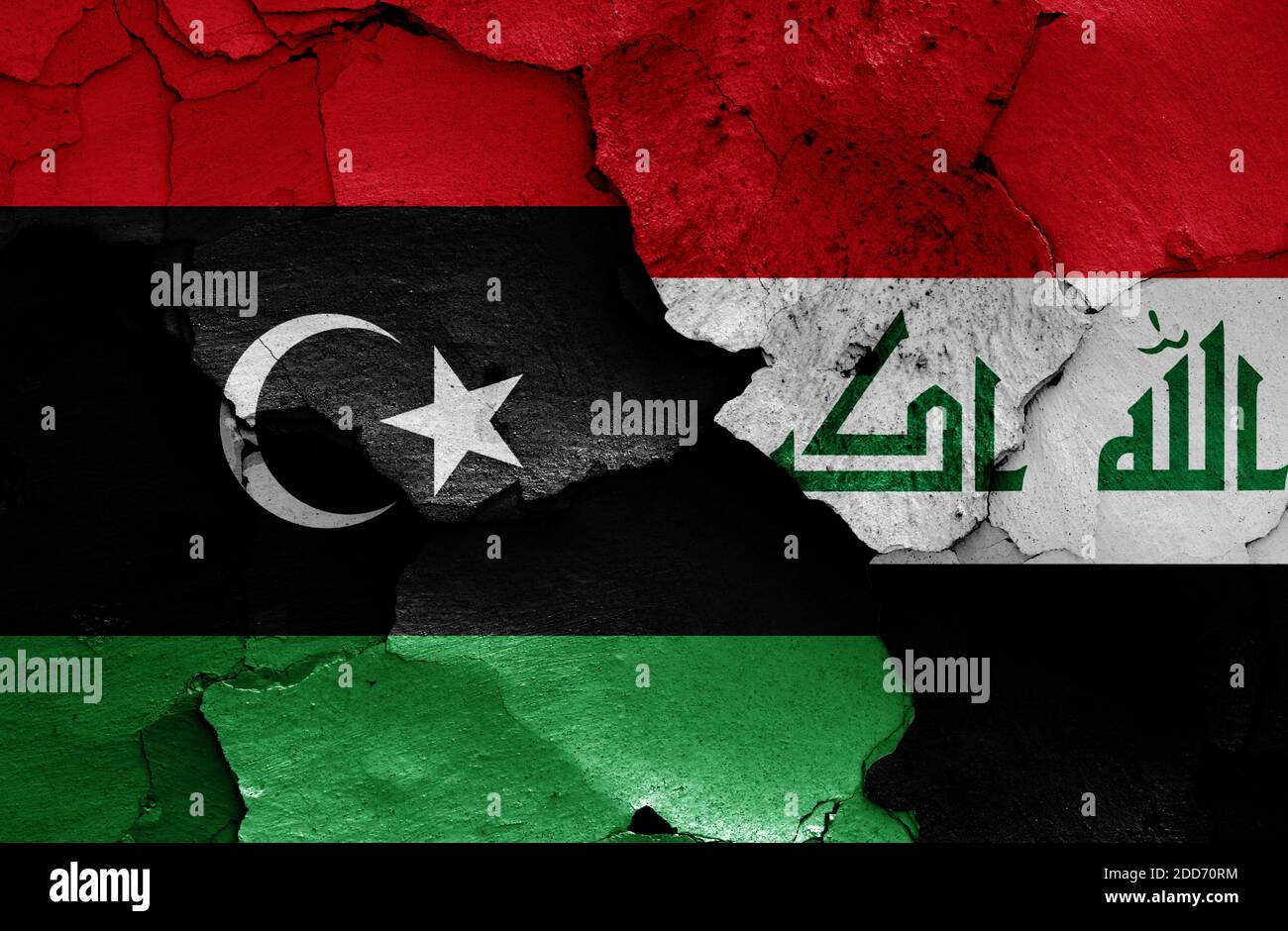 Les drapeaux de la Libye et de l'Irak sont peints sur un mur fissuré Banque D'Images