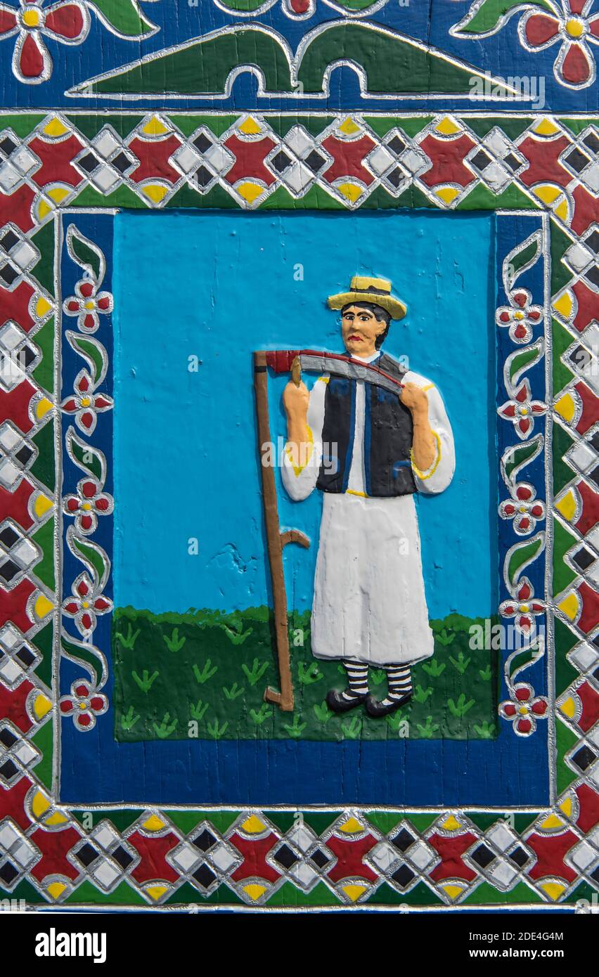 Portrait d'un fermier sur une croix grave dans le Cimetière Joyeux (Cimiturul Vesel), Saparta, Roumanie Banque D'Images