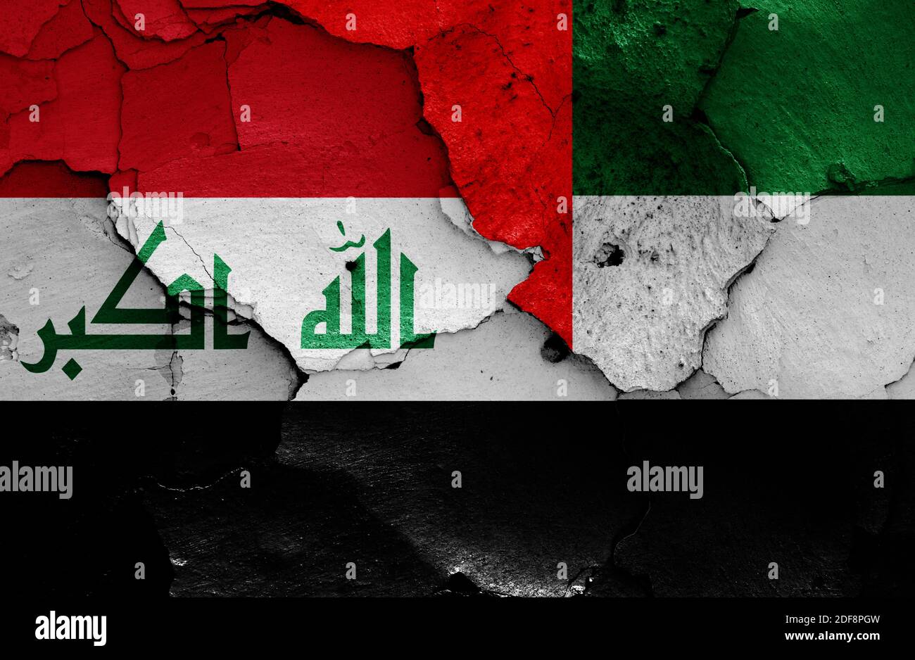 Drapeaux de l'Irak et des Émirats Arabes Unis peints sur un mur fissuré Banque D'Images