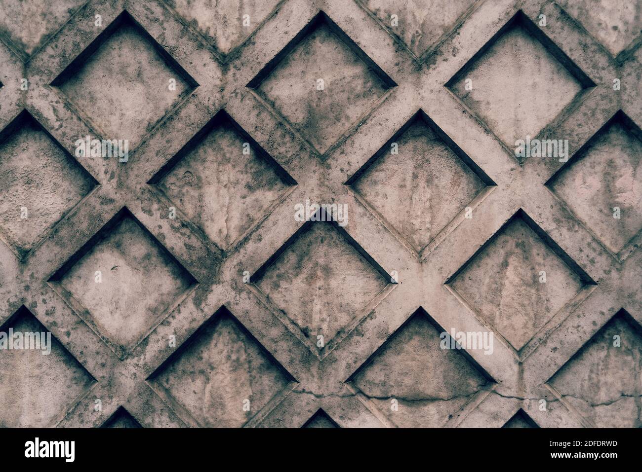 Mur en béton avec texture de formes losange Banque D'Images