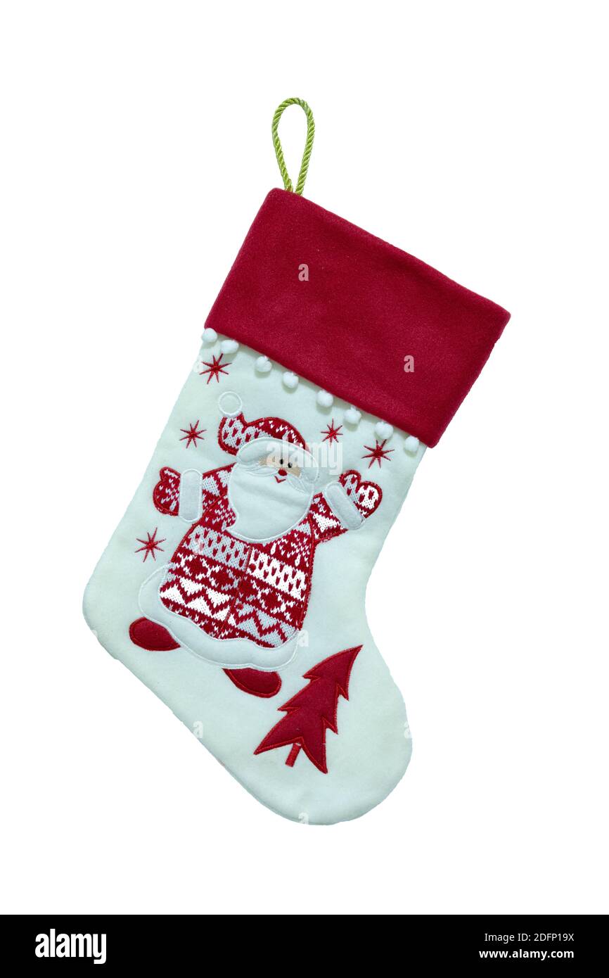 Un joli bas de Noël rouge et blanc vide avec le visage de père noël sur lui et sur un fond blanc. Banque D'Images