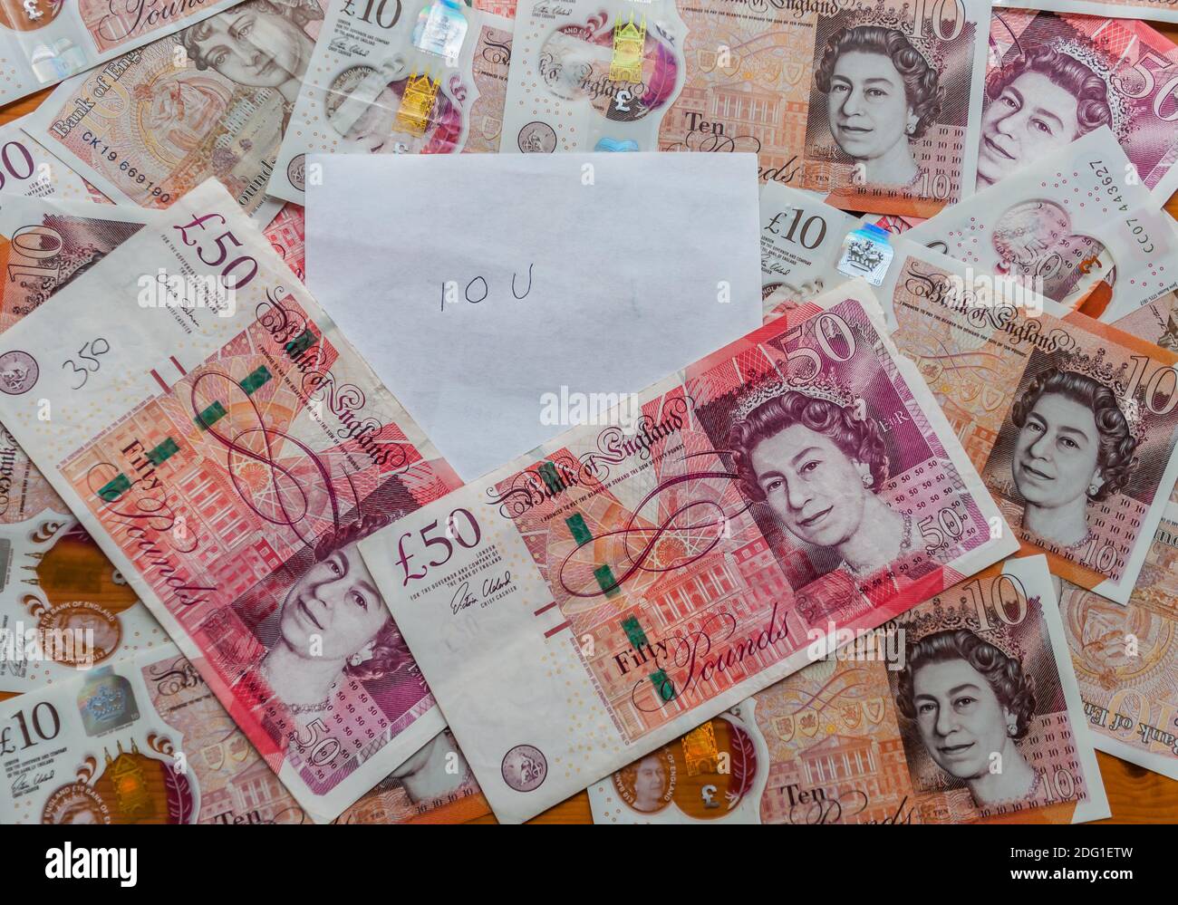 Je vous dois en plus des billets britanniques Banque D'Images