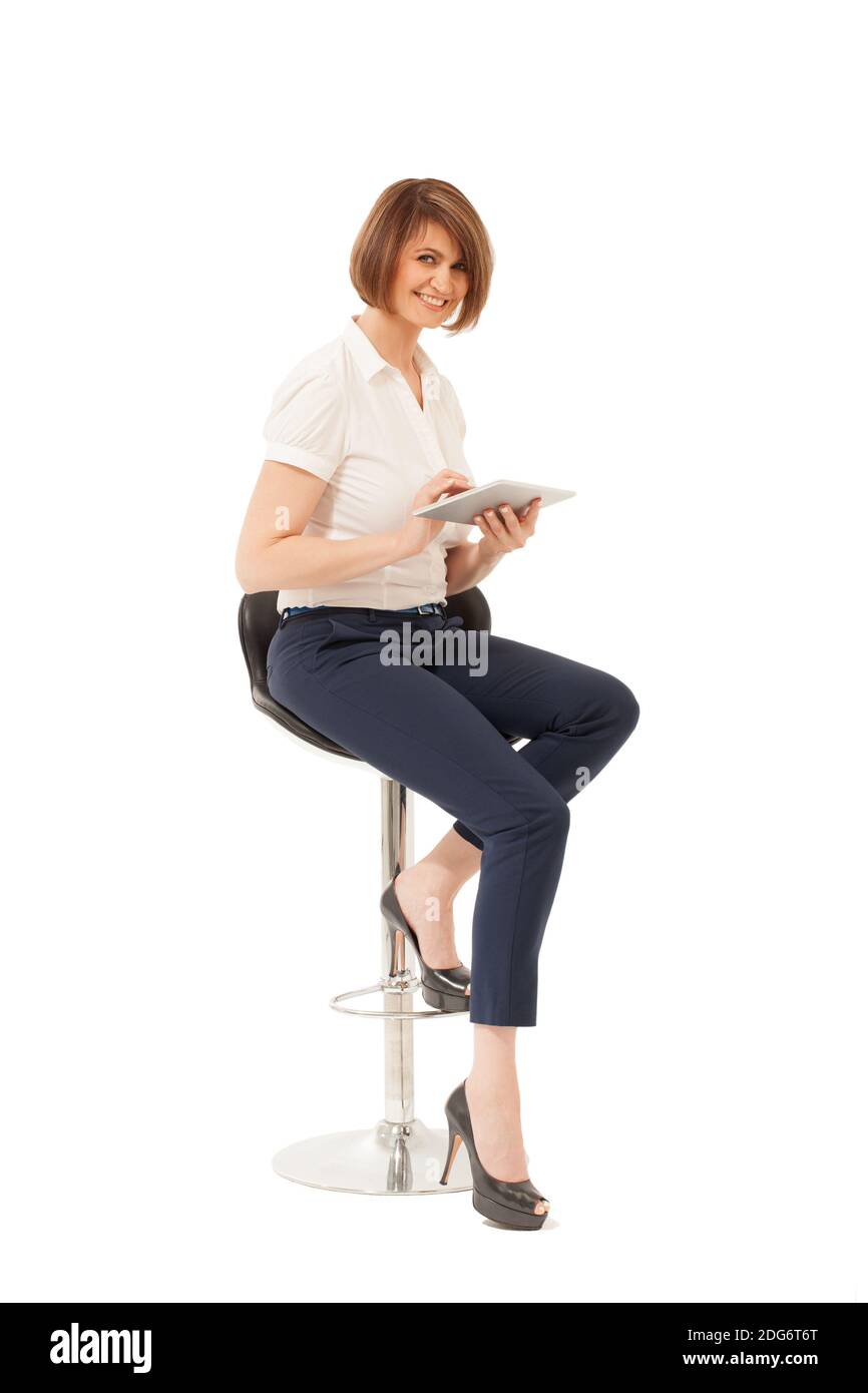 Élégant smiling woman holding tablet Banque D'Images