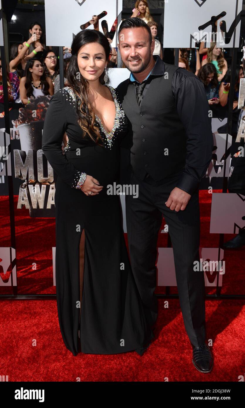 Roger Mathews et Jennifer Farley arrivant aux MTV Movie Awards 2014, le Nokia Theatre L.A. En direct, Los Angeles. Les MTV Movie Awards peuvent être vus au Royaume-Uni sur MTV, le lundi 14 avril à 21h00 Banque D'Images