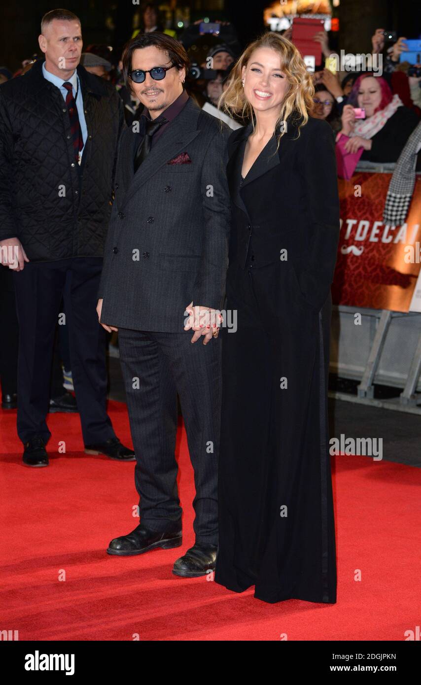 Johnny Depp et Amber entendirent arriver à la première britannique de Mortdecai, Empire Cinema, Leicester Square, Londres Banque D'Images