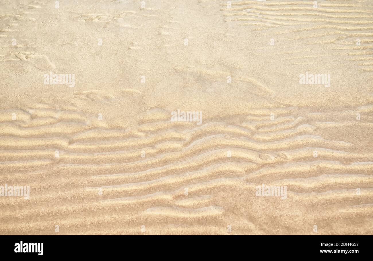 Texture sable vagues de sable et structure de sable à l'extérieur. Banque D'Images