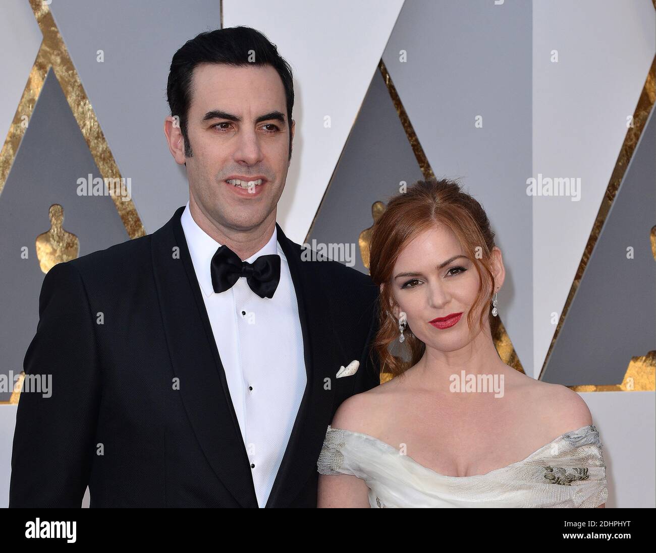 (G-D) Sacha Baron Cohen et Isla Fisher assistent aux 88e Academy Awards à Los Angeles, CA, USA, le 28 février 2016. Photo de Lionel Hahn/ABACAPRESS.COM Banque D'Images