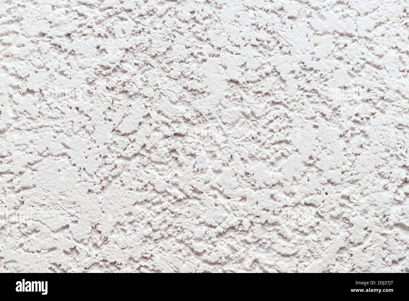 Mur blanc en relief avec plâtre décoratif. Banque D'Images